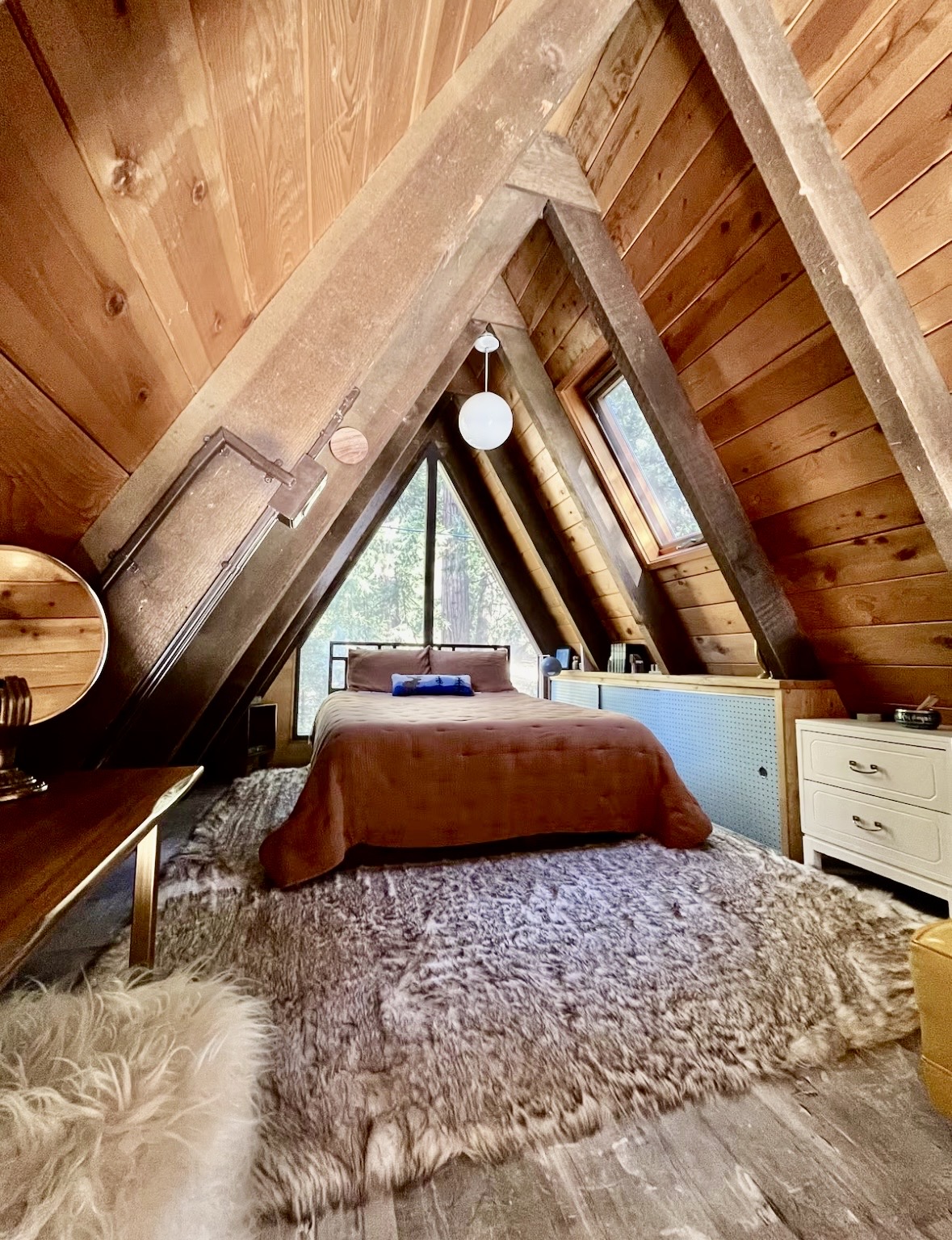 Loft queen bed under the A-Frame peak