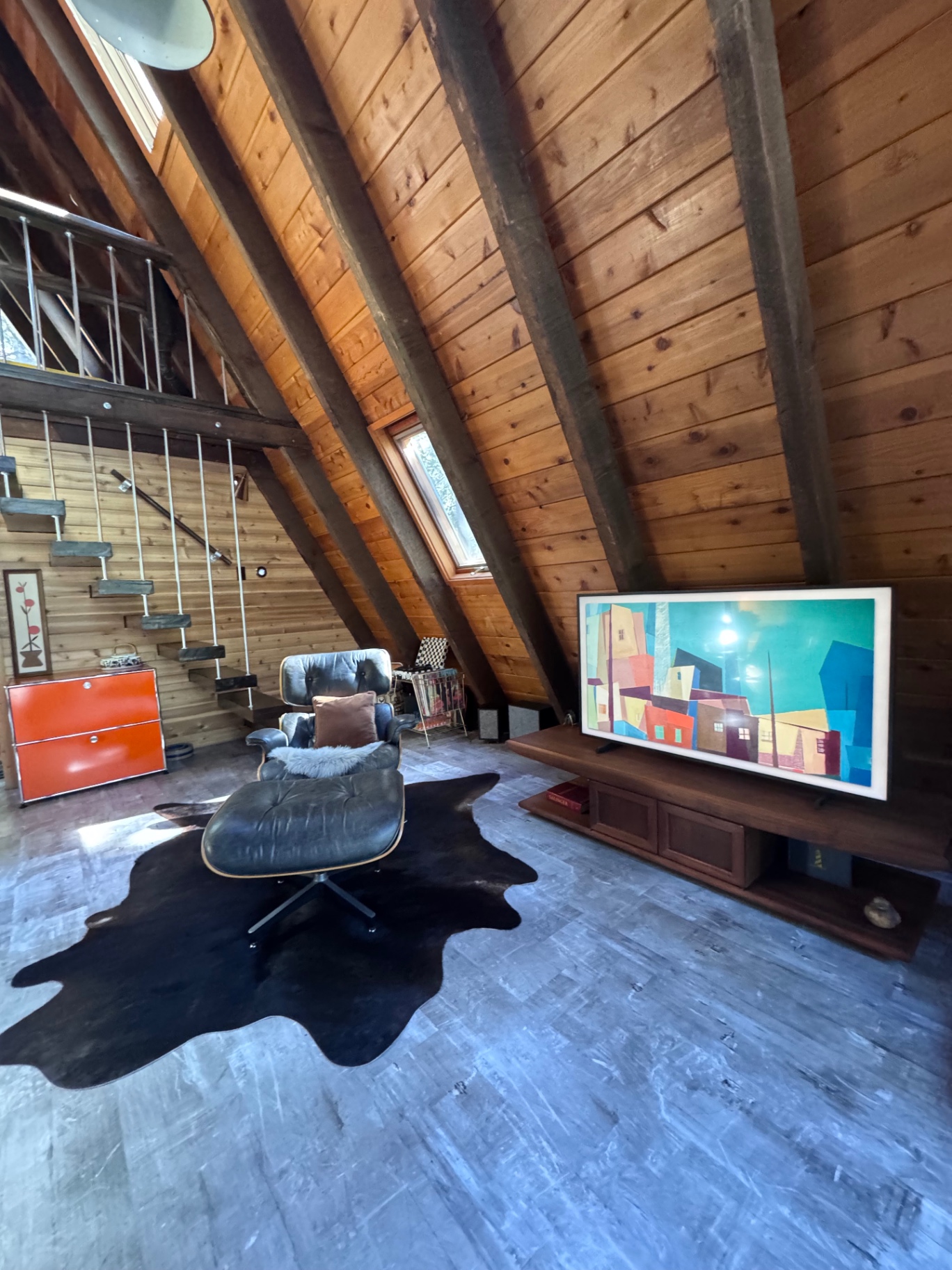 Loft living area with Eames chair and Frame TV
