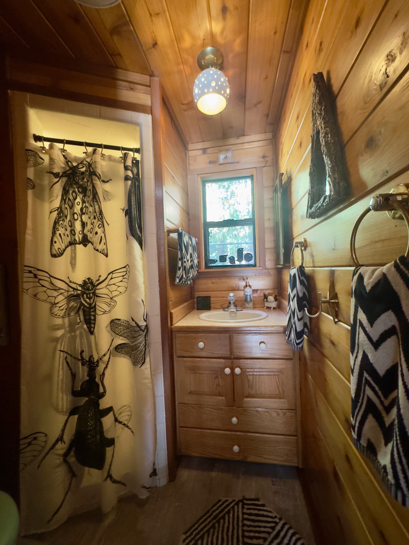 Cedar-lined bath with entomology shower curtain