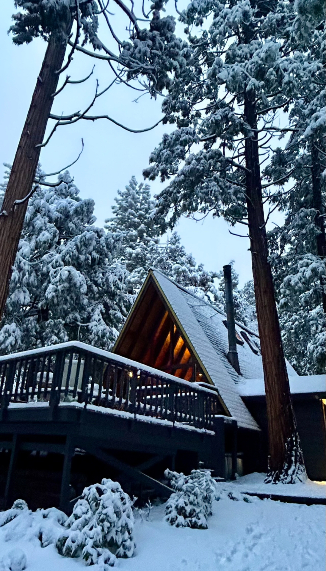 The A-Frame and deck dusted in fresh snow at dusk